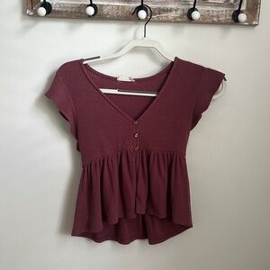 This is an altard state extra small burgundy top that has been barley worn.